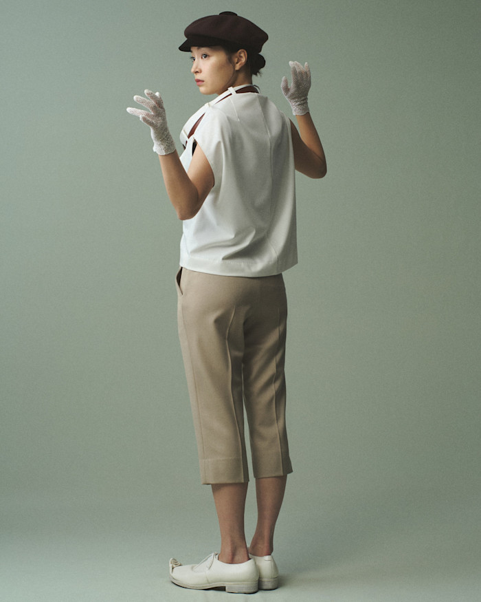 Keisukeyoshida polyester shirt with leather belt detail, £269, and wool capri pants, £231. Pillings leather shoes, £1,053. Haute Mode Hirata wool hat, £171. Gloves, stylist’s own