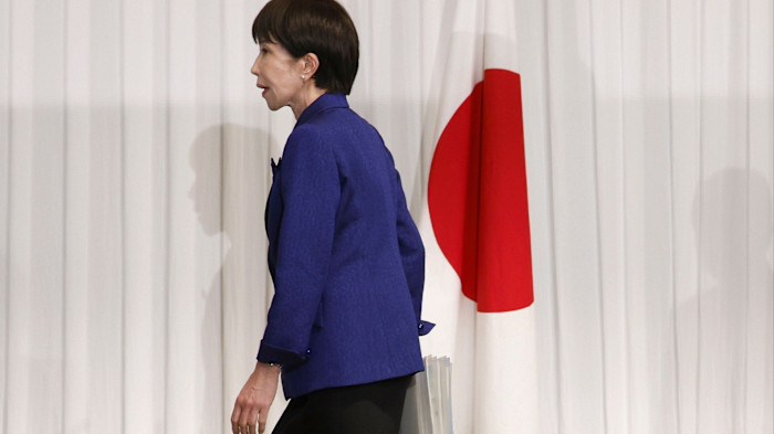 Japan’s Prime Minister Sanae Takaichi, leader of the ruling Liberal Democratic Party, walks on stage for a press conference at the LDP headquarters in Tokyo, Japan