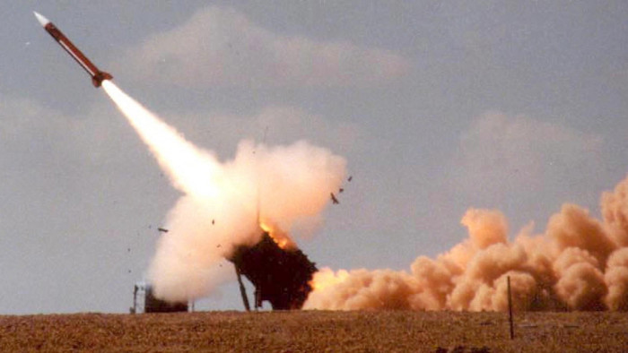 A Patriot missile launches from its launcher, leaving a trail of smoke and flames during a joint Israeli-American military exercise.
