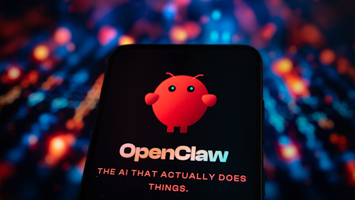 A smartphone screen displays the OpenClaw AI logo and slogan, with a colorful blurred background.