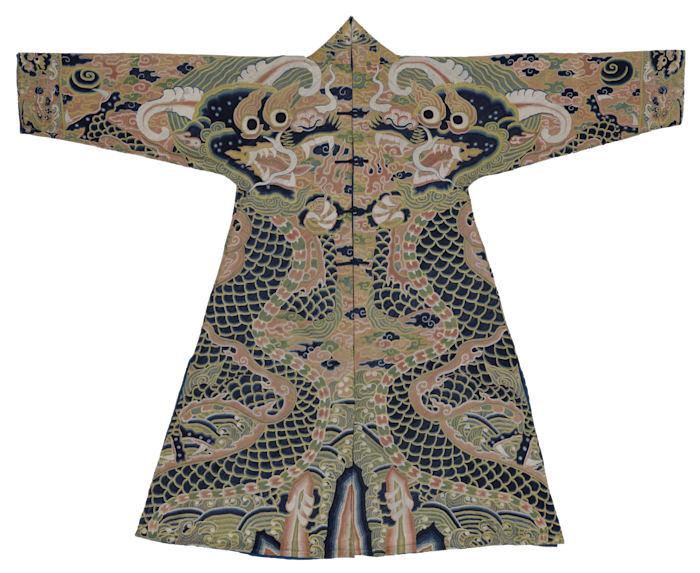 A Ming dynasty robe made of detailed silk embroidery, featuring images of dragons with ox horns, in muted shades of navy blue, pistachio green, gold and pink. 