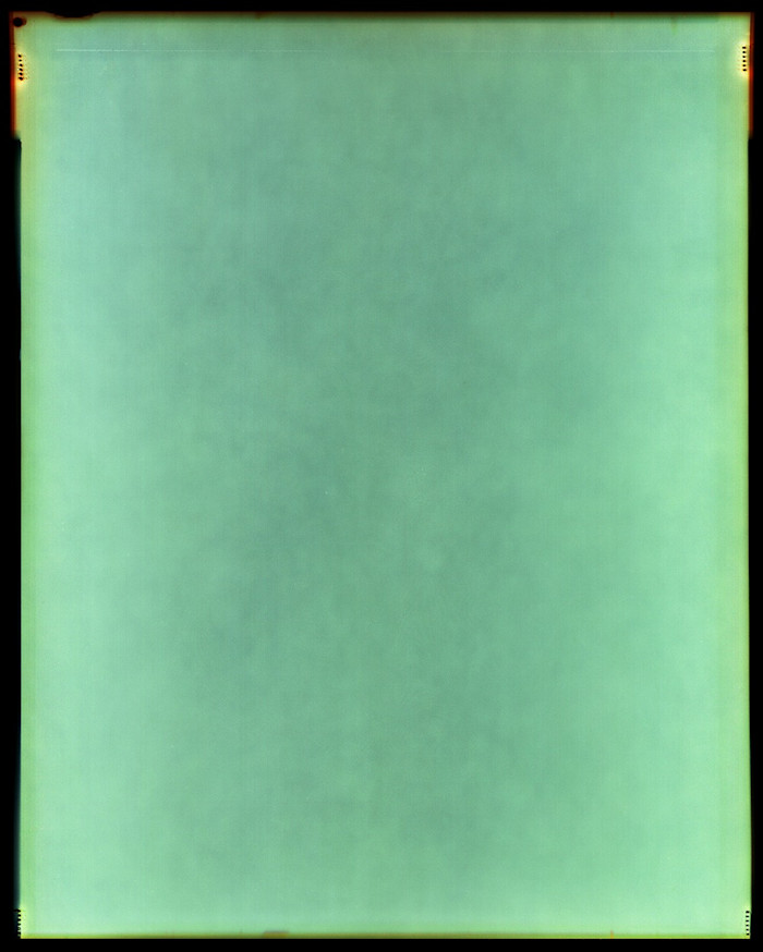 A luminous green surface, created by leaving large-format silver halide film in radioactive soil for six months and then developing it