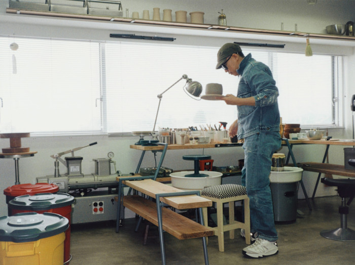 Nigo in his studio with a&nbsp;pugmill, a machine that compresses ceramic clay&nbsp;