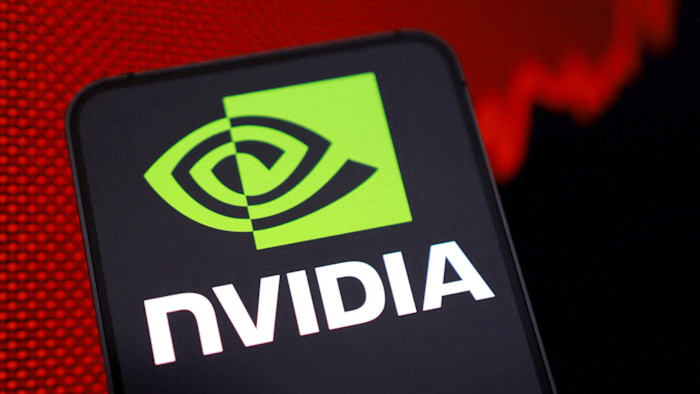 Nvidia logo displayed on a screen with a rising red stock graph in the background.