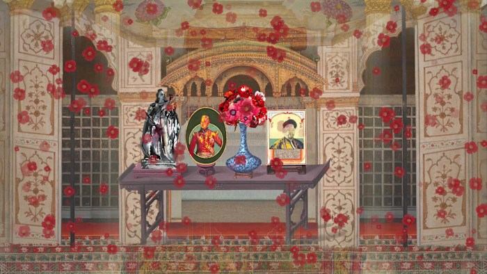 A black table stands in what looks like a poppy-strewn Mughal palace. On the table is a sculpture of someone who looks like Queen Victoria, a colourful portrait of the Duke of Wellington, a Ming vase containing red flowers, and a portrait of what looks like a figure from Chinese history. 