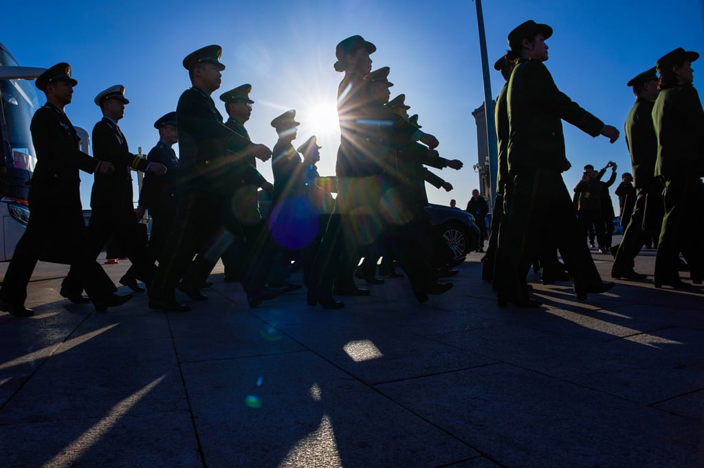 Military delegates arrive for a plenary session of the National People’s Congress held at the Great Hall of the People in Beijing on Monday. Photo: AP