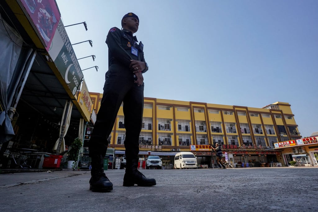 A Cambodian police officer stands guard near a deserted scam compound in Kampot province, Cambodia, in February. Photo: Reuters A Cambodian police officer stands guard near a deserted scam compound in Kampot province, Cambodia, in February. Photo: Reuters