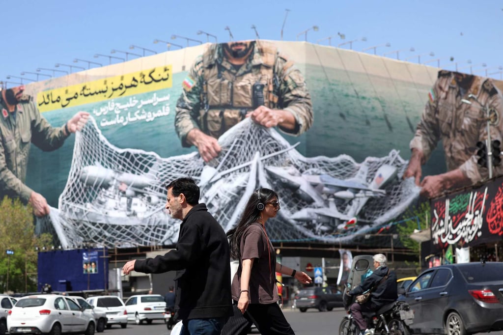 A billboard in Tehran reads: ‘The Strait of Hormuz remains closed’. Photo: AFP