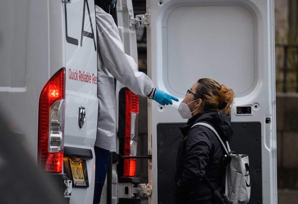 A person receives a Covid-19 test in New York in early 2022. The pandemic marked a low point in US-China relations during the years between Trump’s two Beijing visits. Photo: AFP