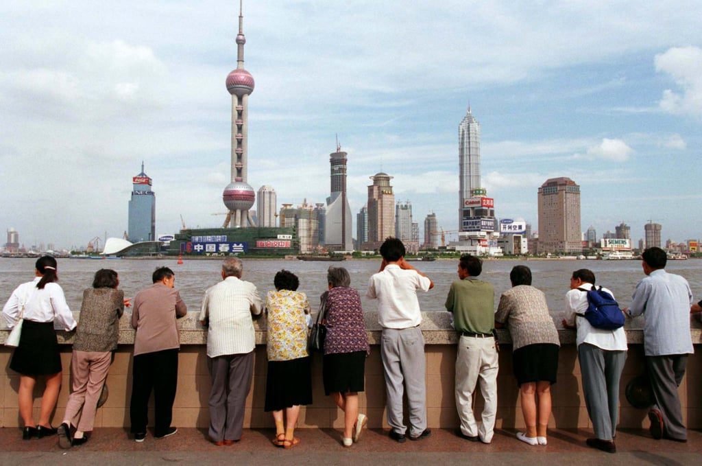 Visitors admire the Pudong New Area, Shanghai’s booming financial district, on September 26, 1998. Photo: Reuters Visitors admire the Pudong New Area, Shanghai’s booming financial district, on September 26, 1998. Photo: Reuters